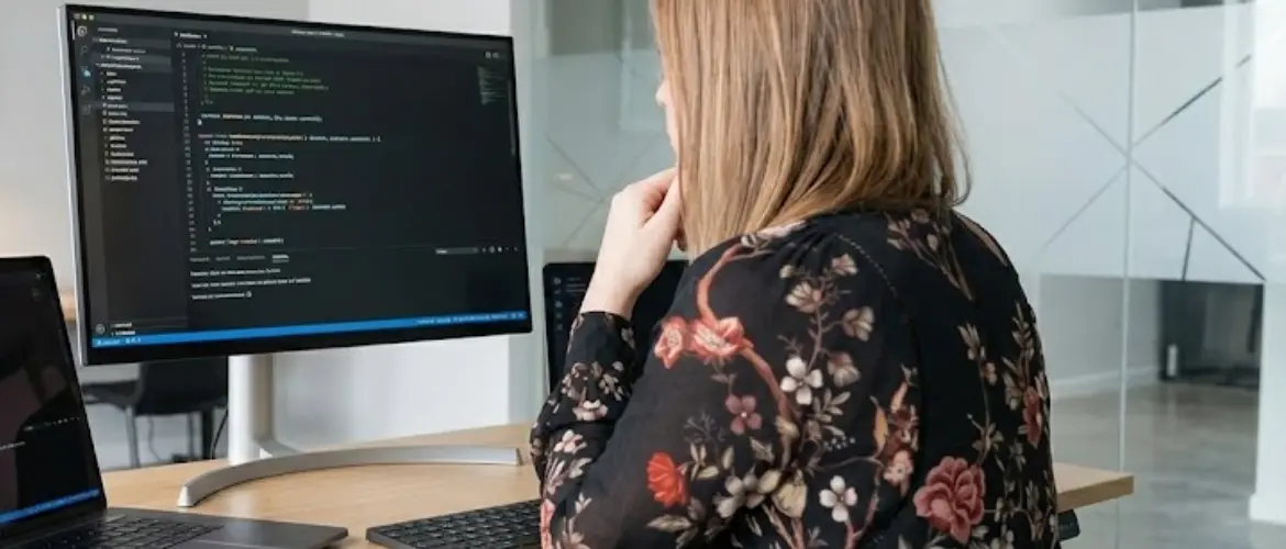 developer women working at monitor